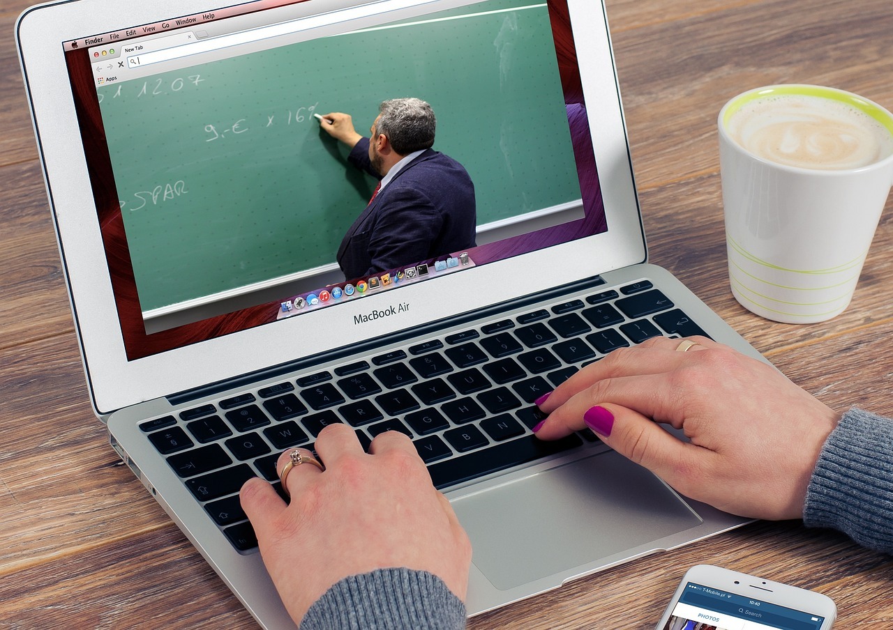 laptop-with-teacher-writing-on-board-in-the-screen