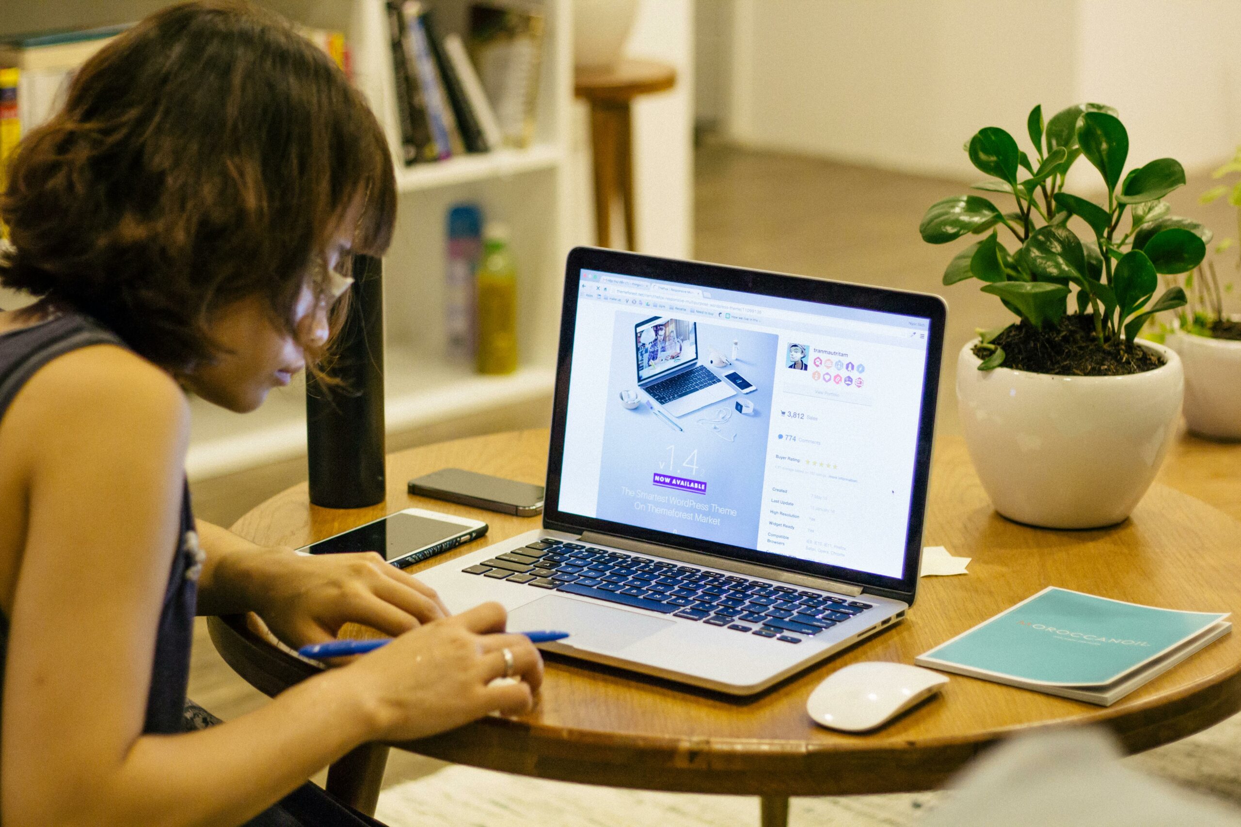 person-sitting-at-a-table-using-a-laptop